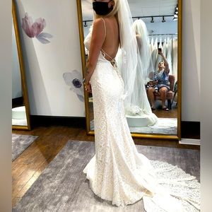 Ivory lace wedding dress with almond underlay
